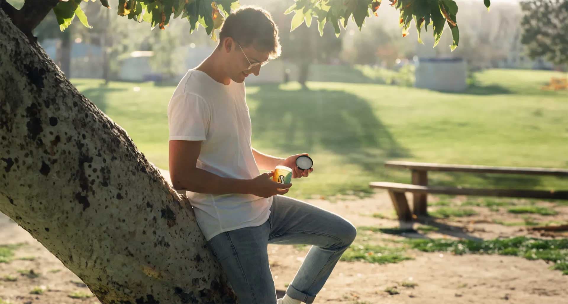 Man holding CBD Gummies in a park