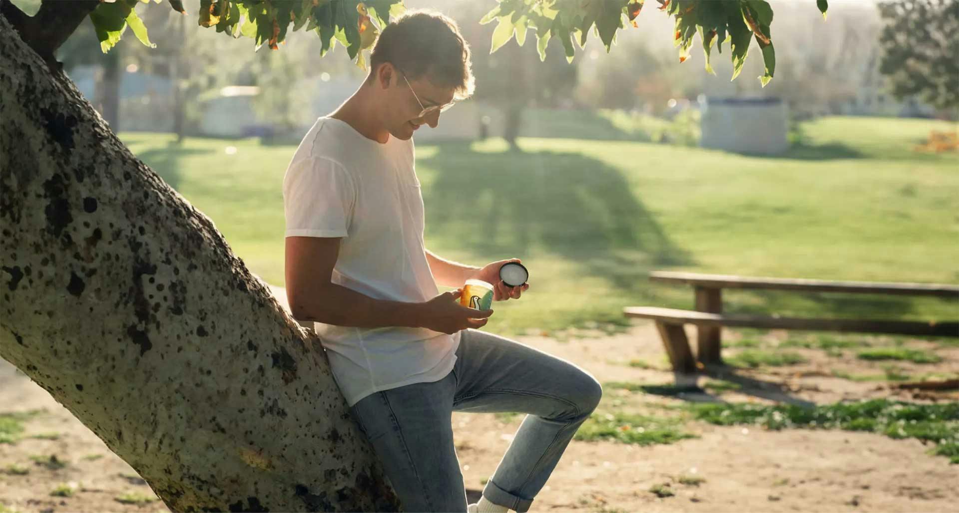 Man holding CBD Gummies in a park