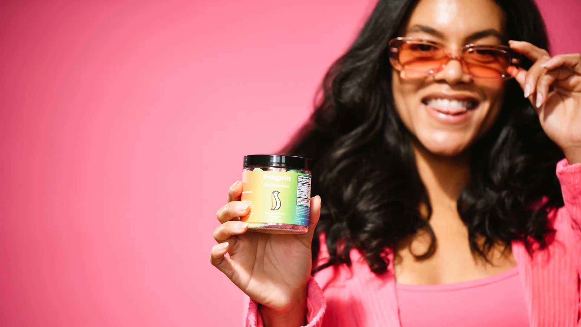 Woman holding CBD Gummies